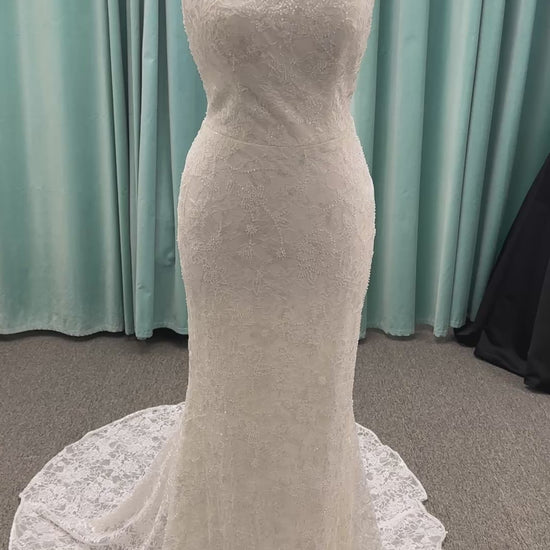 Stella York 7954 halter wedding dress with embellished floral lace, beaded detail, and fitted column silhouette with low back