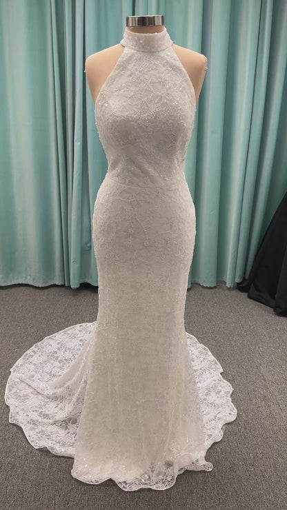 Stella York 7954 halter wedding dress with embellished floral lace, beaded detail, and fitted column silhouette with low back