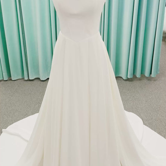 Stella York SY8180 A-line wedding dress on mannequin with wide straps, square neckline, contoured matte satin bodice, angled waist, and soft A-line skirt
