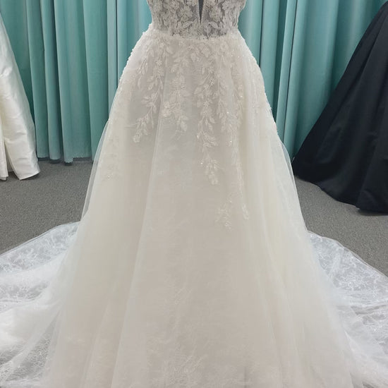 Morilee Style 2736 botanical A-line wedding dress with plunging v-neckline, beaded trim, 3D embroidered lace over Chantilly lace, and open v-back