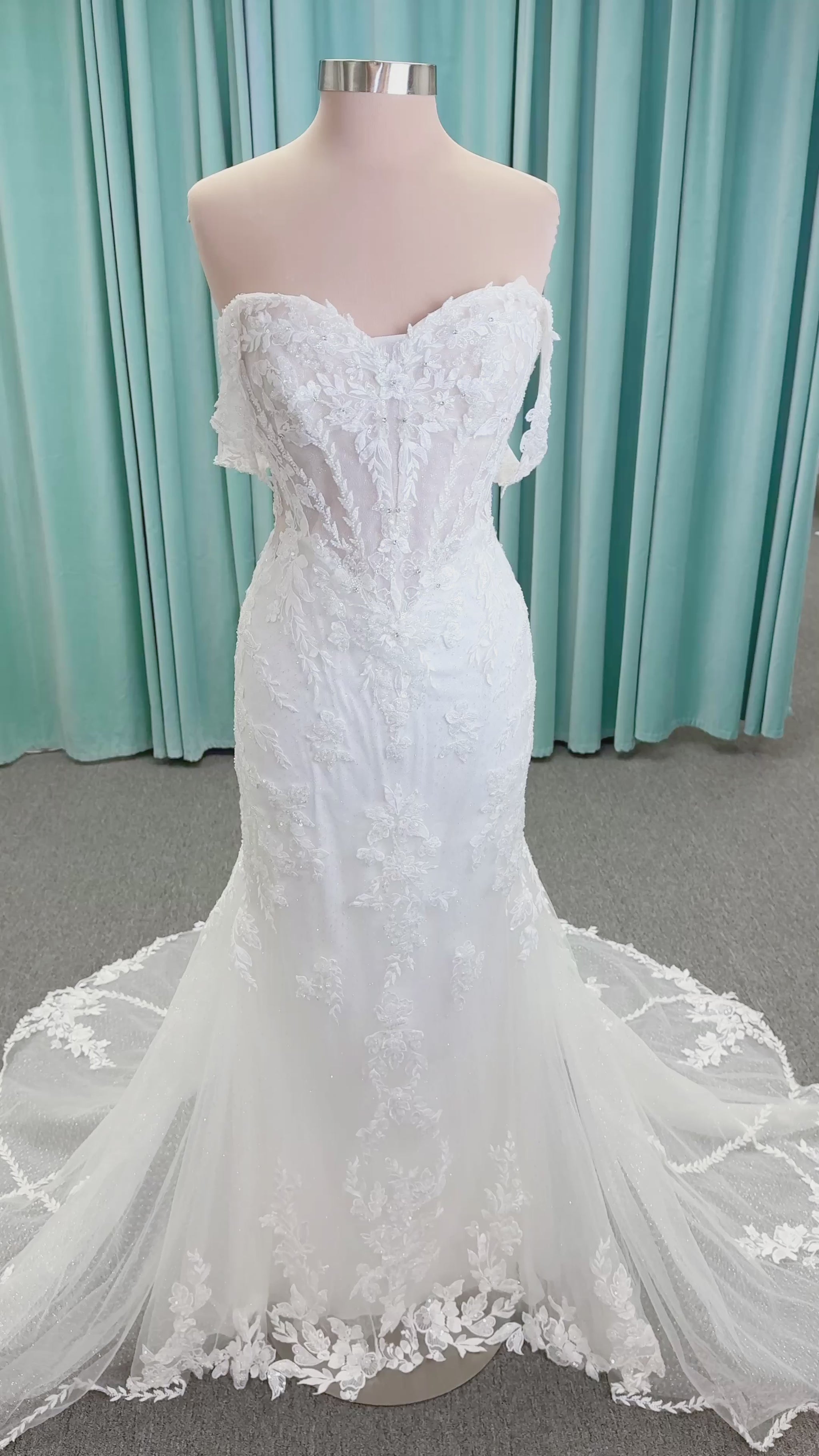 Randy Fenoli Jillian fit and flare wedding dress on mannequin with strapless sweetheart neckline, beaded lace appliqué, detachable off-the-shoulder straps, and glitter tulle skirt