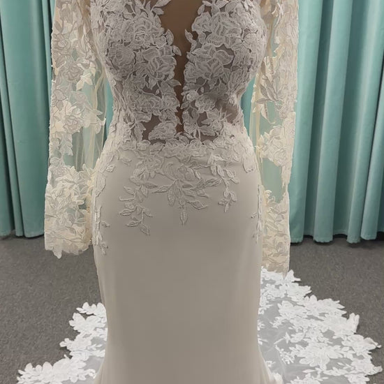 Long sleeve lace wedding dress with sheer illusion bodice and fitted skirt, featuring intricate floral lace and a soft train by Essense of Australia Style D3379