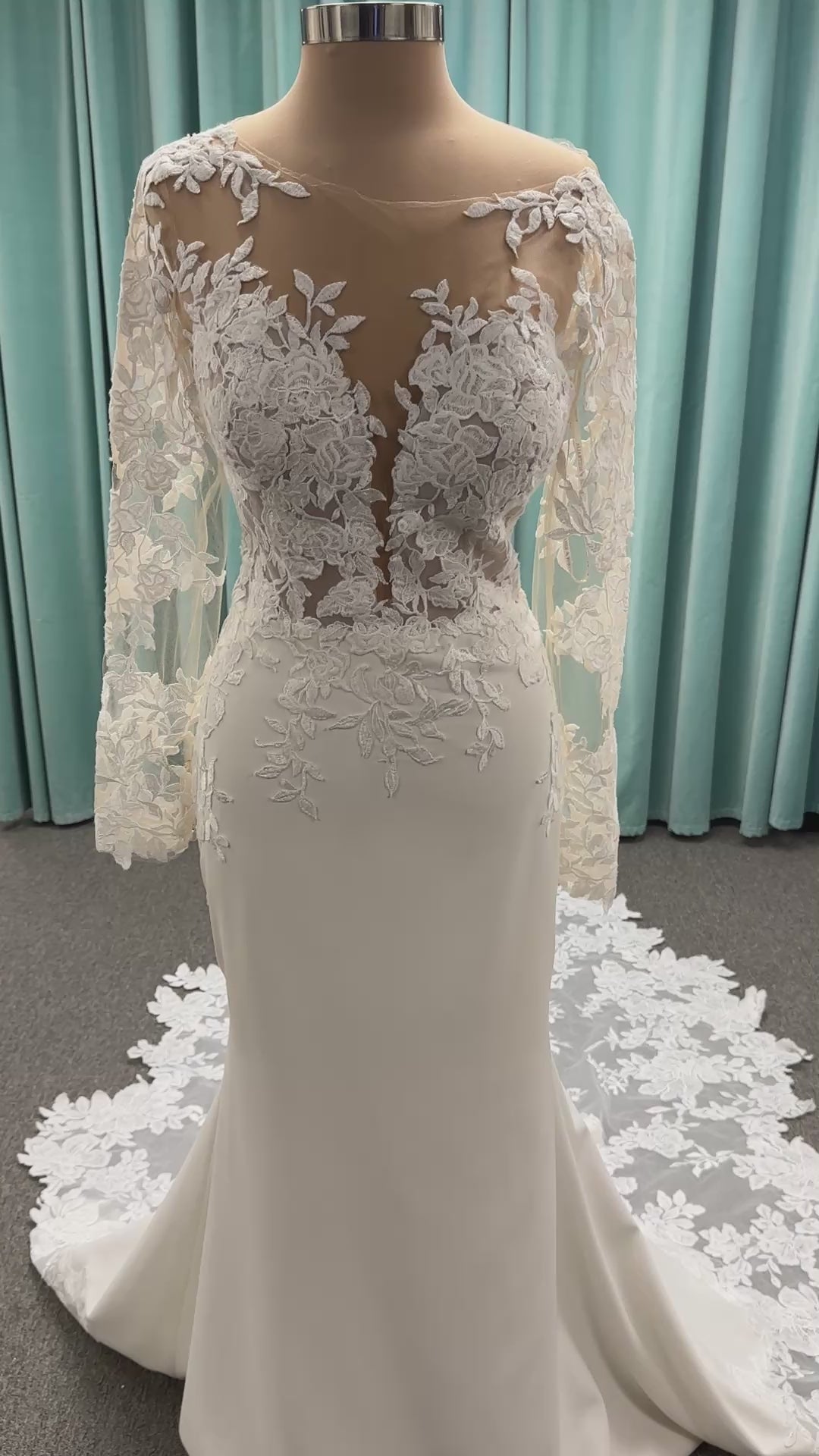 Long sleeve lace wedding dress with sheer illusion bodice and fitted skirt, featuring intricate floral lace and a soft train by Essense of Australia Style D3379
