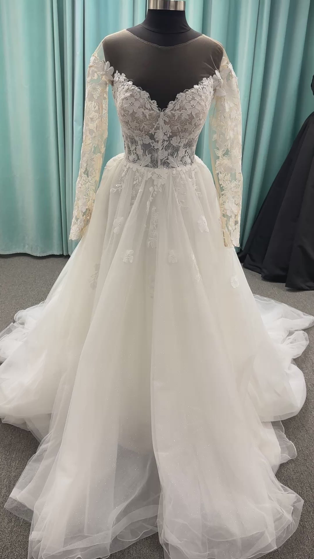 Stella York Style 8012 lace and tulle ballgown wedding dress with sheer sweetheart bodice, off-the-shoulder long lace sleeves, and full princess skirt