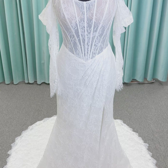 Morilee 2983 Leto fit and flare wedding dress with scoop neckline, lace corset bodice, glitter tulle, detachable draped sleeves, thigh-high slit, and sweeping train.