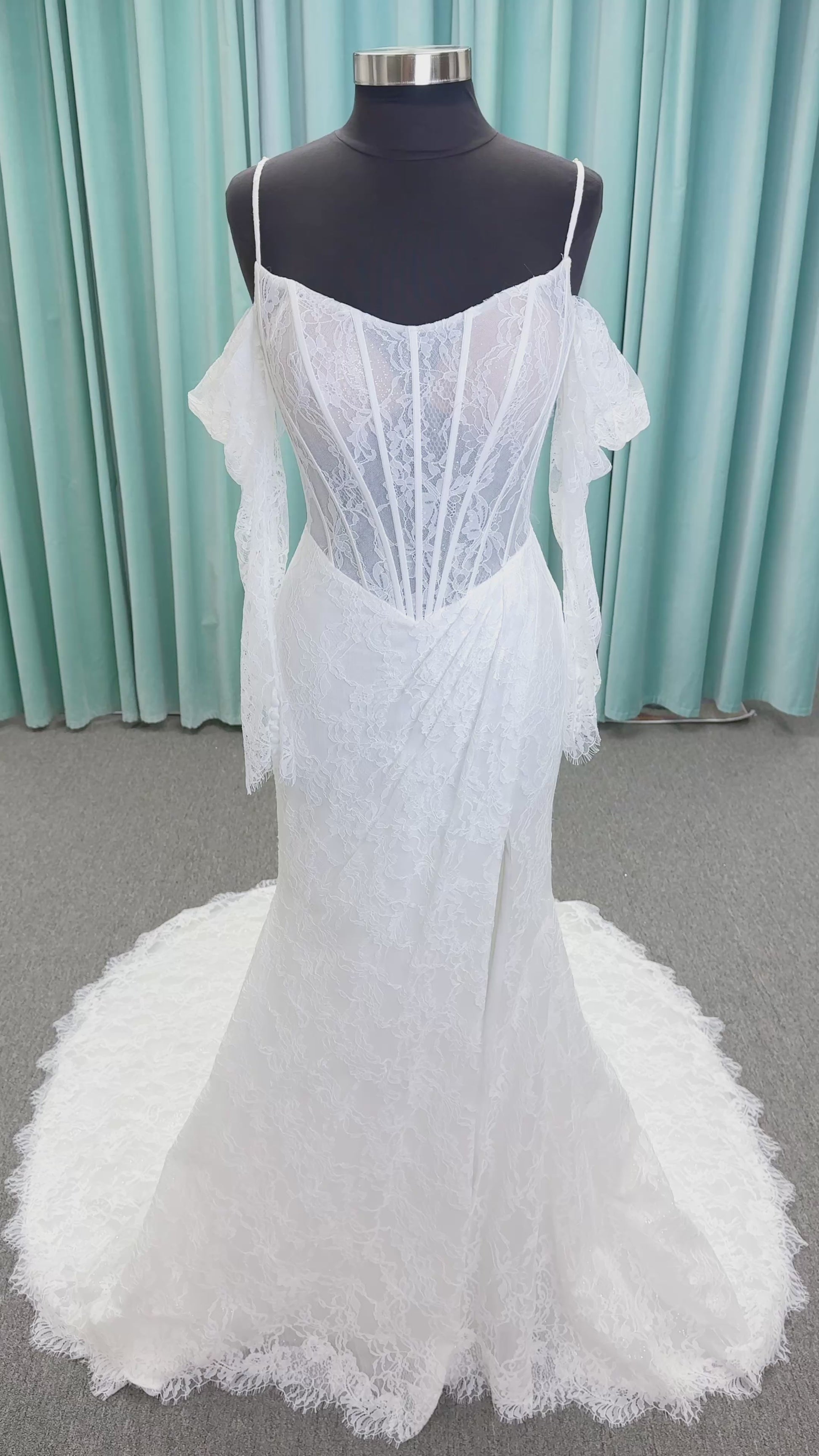 Morilee 2983 Leto fit and flare wedding dress with scoop neckline, lace corset bodice, glitter tulle, detachable draped sleeves, thigh-high slit, and sweeping train.