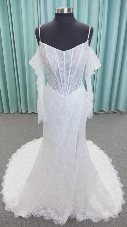 Morilee 2983 Leto fit and flare wedding dress with scoop neckline, lace corset bodice, glitter tulle, detachable draped sleeves, thigh-high slit, and sweeping train.