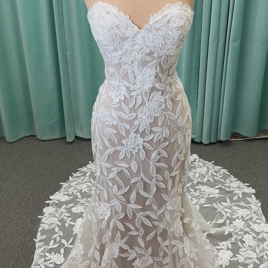 Morilee Santana wedding dress style 2739 featuring strapless sweetheart neckline, floral beaded lace, detachable long sleeves with bow streamers, and fit and flare silhouette