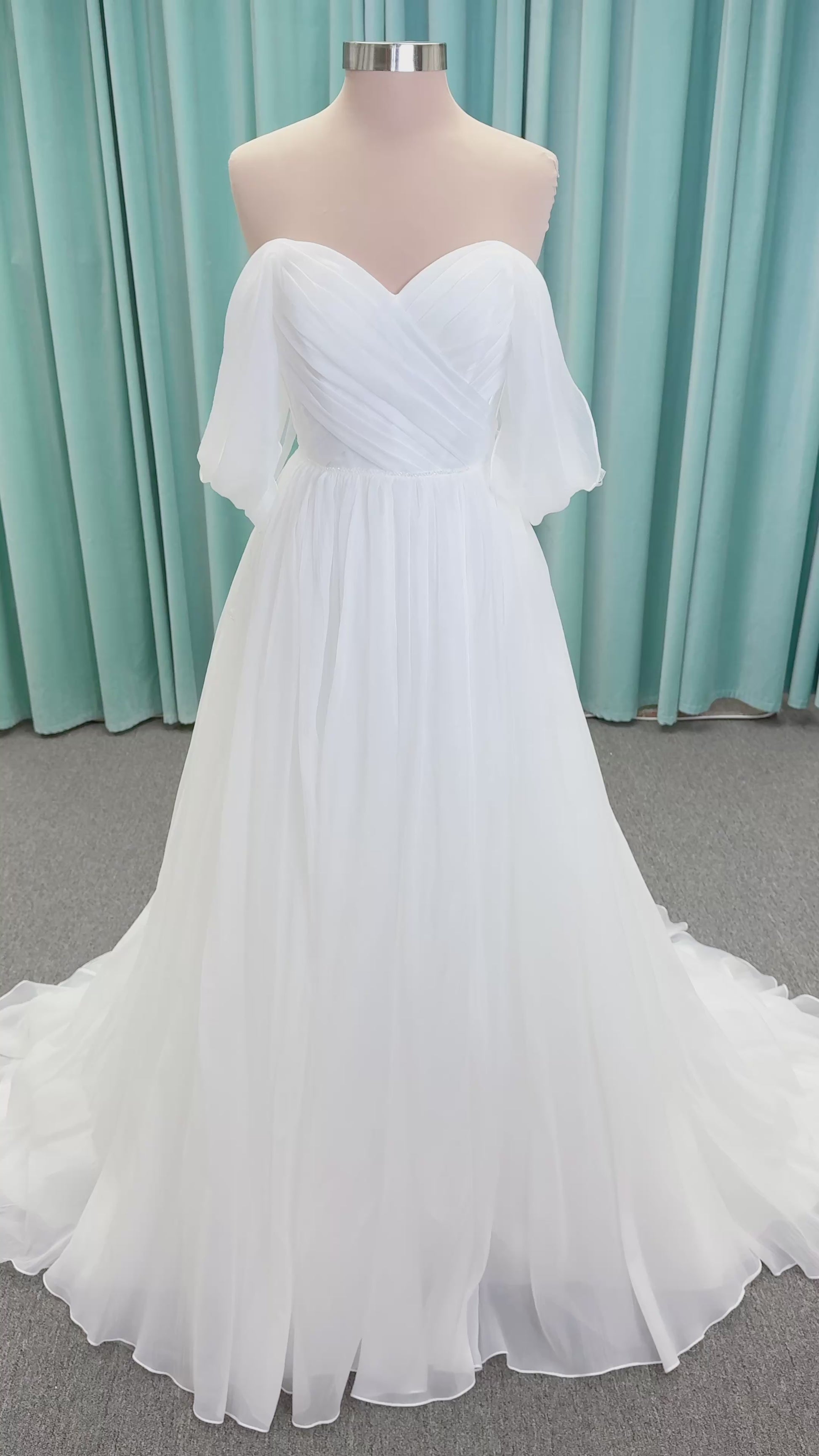 Morilee 2910L Levana A-line wedding dress on mannequin with sweetheart strapless neckline, off-the-shoulder sleeves, draped organza bodice, and beaded waistband