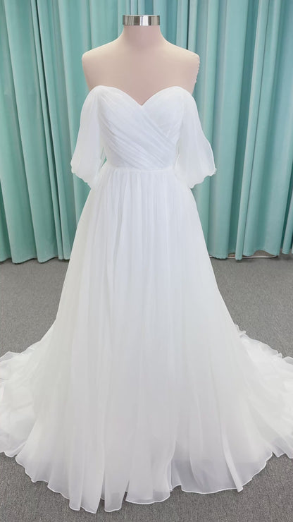 Morilee 2910L Levana A-line wedding dress on mannequin with sweetheart strapless neckline, off-the-shoulder sleeves, draped organza bodice, and beaded waistband
