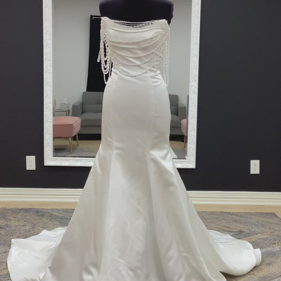  Morilee Atete wedding dress style 2921, a satin fit and flare bridal gown with a strapless scoop neckline and detachable pearl drape.