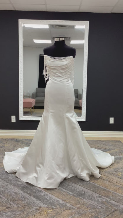 Morilee Atete wedding dress style 2921, a satin fit and flare bridal gown with a strapless scoop neckline and detachable pearl drape.