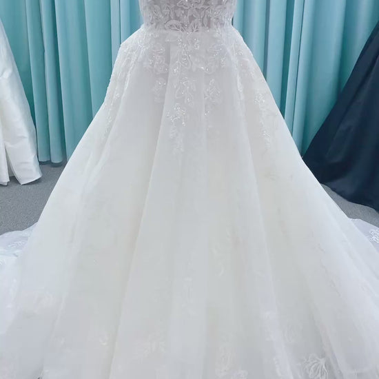 Morilee 2988 Rosie ball gown wedding dress in rose-printed organza over glitter tulle with V-neck, thin straps, structured boning, and voluminous sweeping train.