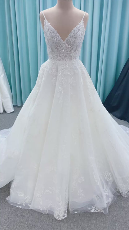 Morilee 2988 Rosie ball gown wedding dress in rose-printed organza over glitter tulle with V-neck, thin straps, structured boning, and voluminous sweeping train.