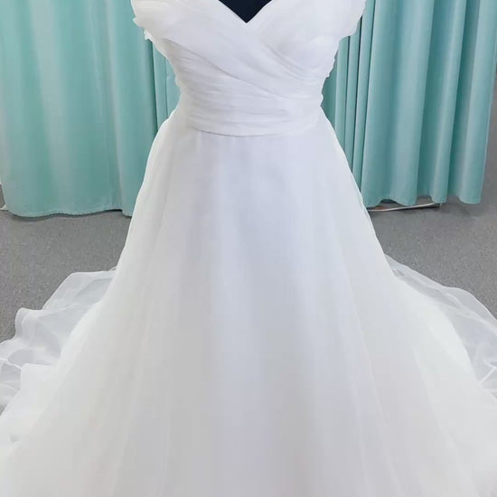 Morilee 3350 Evette ball gown wedding dress in draped organza with off-the-shoulder surplice bodice, horsehair-edged skirt, and covered buttons to hem.