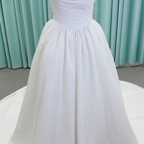 Morilee 1010003 Eleve A-line wedding dress on mannequin with scoop neckline, Chantilly lace peek-a-boo detail, beaded straps, and lace-up corset back