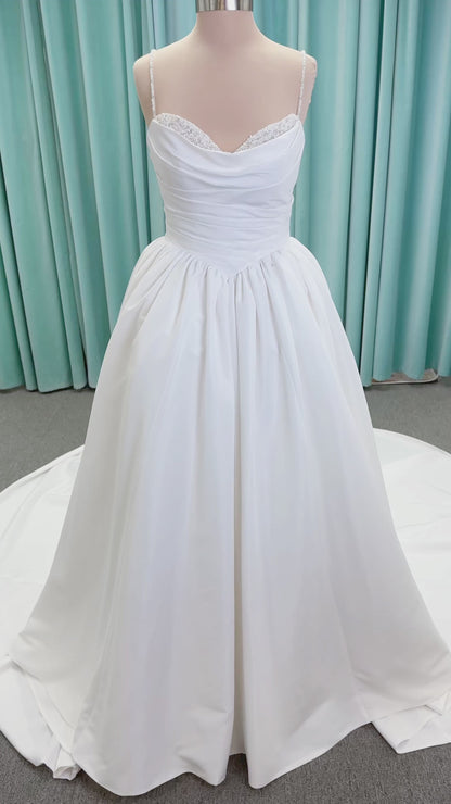Morilee 1010003 Eleve A-line wedding dress on mannequin with scoop neckline, Chantilly lace peek-a-boo detail, beaded straps, and lace-up corset back