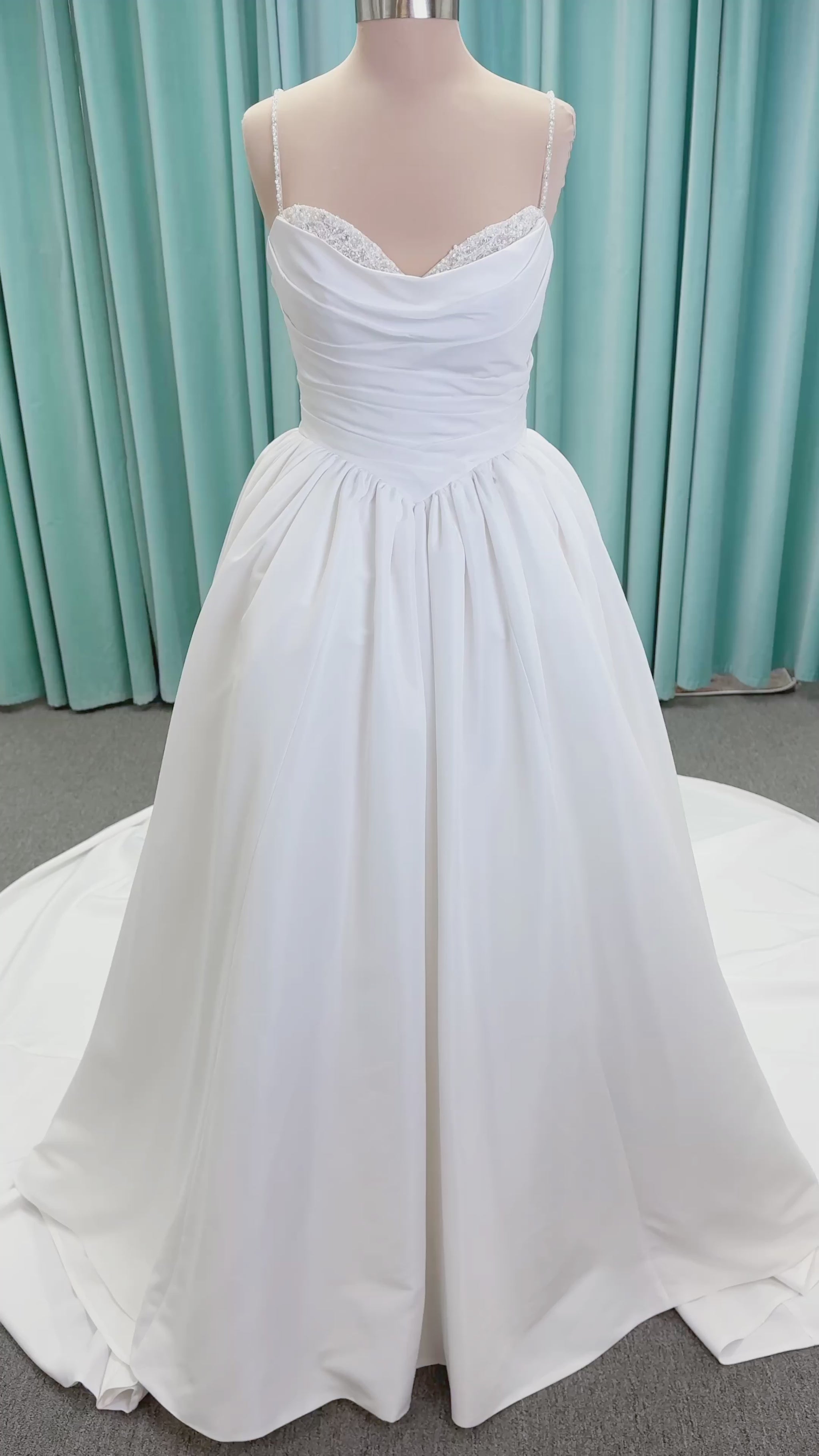 Morilee 1010003 Eleve A-line wedding dress on mannequin with scoop neckline, Chantilly lace peek-a-boo detail, beaded straps, and lace-up corset back