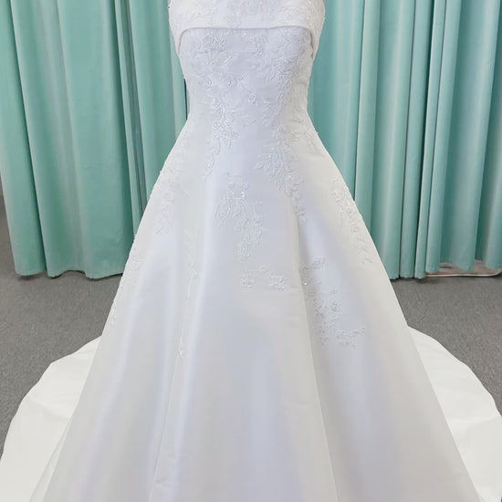 Morilee 1010037 Isadora A-line wedding dress on mannequin with strapless cuffed neckline, princess seams, and beaded Mikado lace