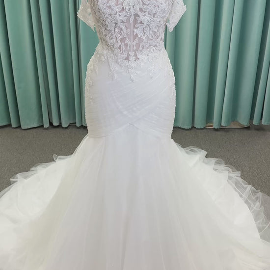Morilee 4467 Rowena fit and flare wedding dress on mannequin with sheer corset bodice, frosted lace appliques, sweetheart neckline, and detachable off-the-shoulder sleeves