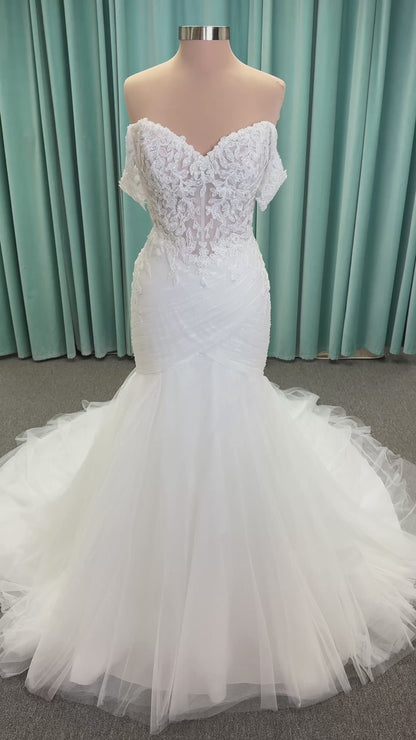 Morilee 4467 Rowena fit and flare wedding dress on mannequin with sheer corset bodice, frosted lace appliques, sweetheart neckline, and detachable off-the-shoulder sleeves