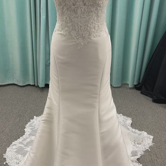 Strapless Mikado fit-and-flare wedding dress with corset bodice, exposed boning, lace detailing, and dramatic lace train by Stella York Style SY8163
