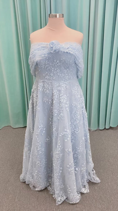 Morilee MLNY 73101 A-line mother of the bride dress on mannequin with strapless sweetheart neckline, detachable off-the-shoulder drape, 3D floral bodice, layered floral lace appliques, and full tulle skirt with pockets