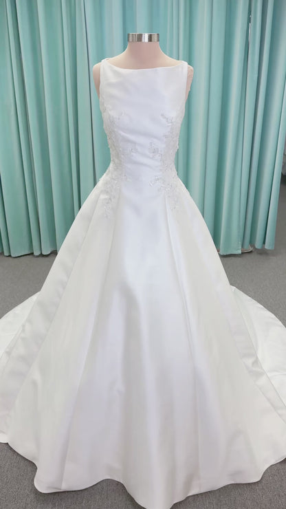 Morilee 1050018 Glissade A-line wedding dress on mannequin with high neckline, 3D floral lace appliques, satin, and beading