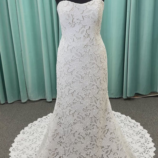 Patty ivory strapless sheath wedding dress on mannequin with sweetheart neckline and lace detail.
