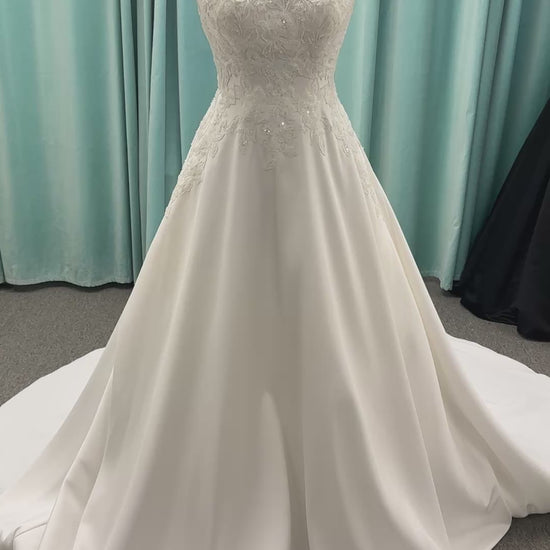 Stella York 7897 Mikado A-line wedding dress with square neckline, wide straps, lace bodice detail, and pockets