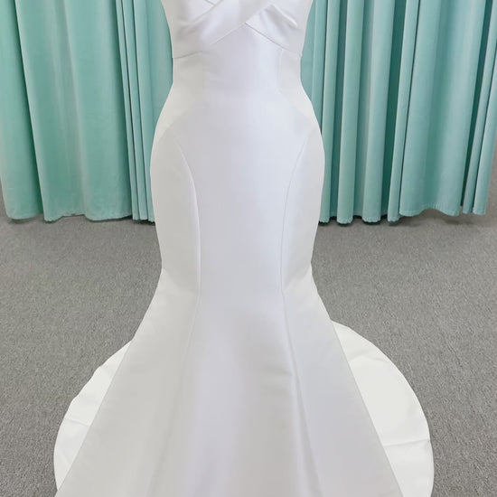 Randy Fenoli Imani fit and flare wedding dress on mannequin with strapless sweetheart neckline, structured mikado bodice, and oversized back bow with covered buttons