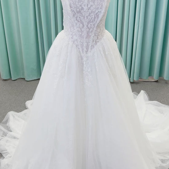 Morilee 2714 Seattle ballgown wedding dress on mannequin with crescent neckline, beaded embroidered lace, basque waist, and detachable illusion sleeves