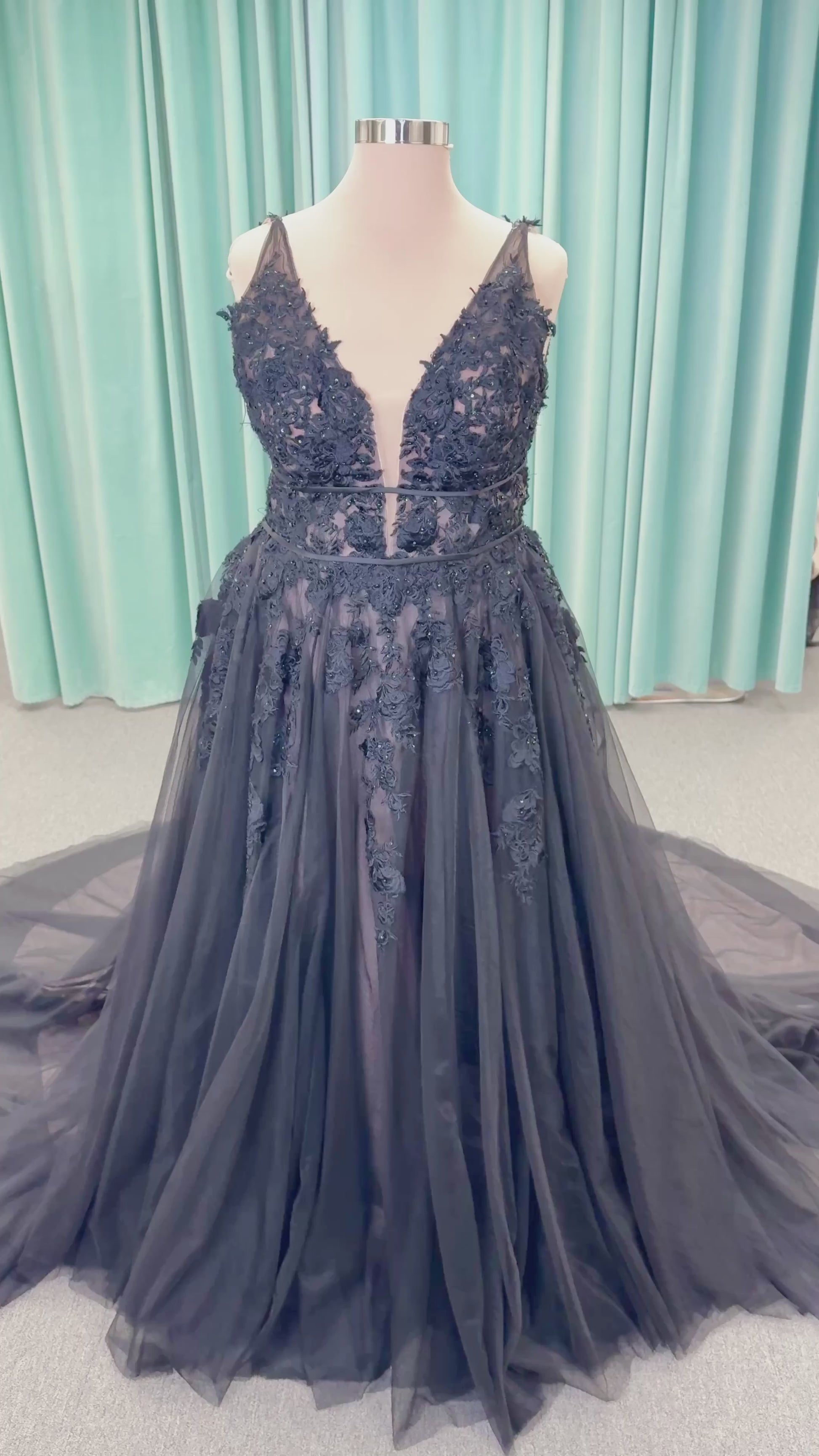 Morilee 5763 Rosa plus size A-line wedding dress on mannequin with plunging V-neckline, double banded waist, and crystal beaded floral lace appliques