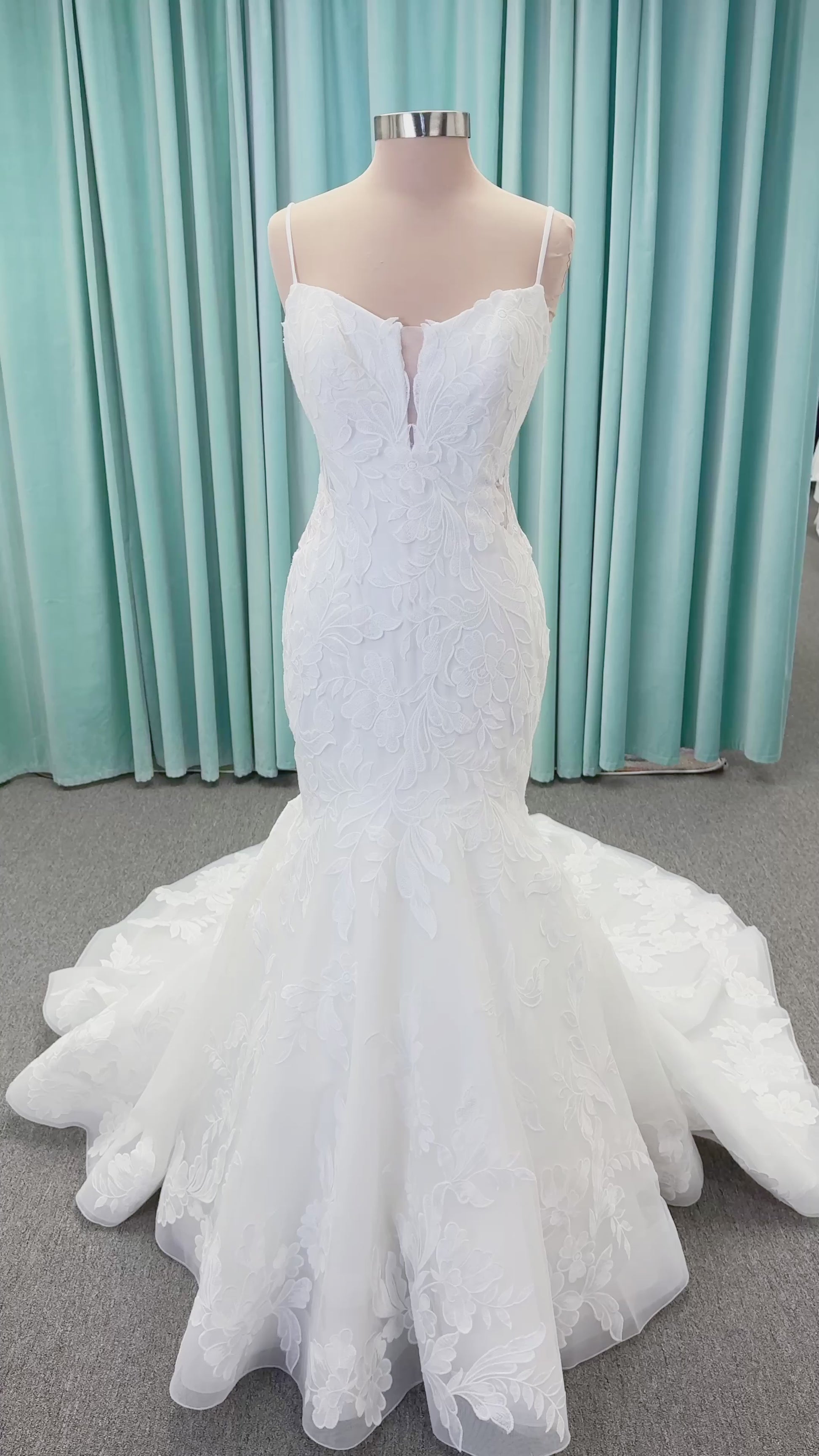 Morilee 2904 Selene fit and flare wedding dress on mannequin with spaghetti straps, plunge neckline, illusion side cutouts, and open back