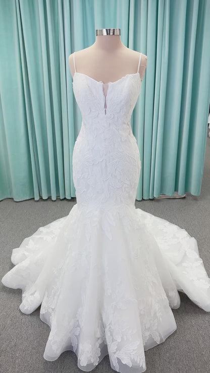 Morilee 2904 Selene fit and flare wedding dress on mannequin with spaghetti straps, plunge neckline, illusion side cutouts, and open back