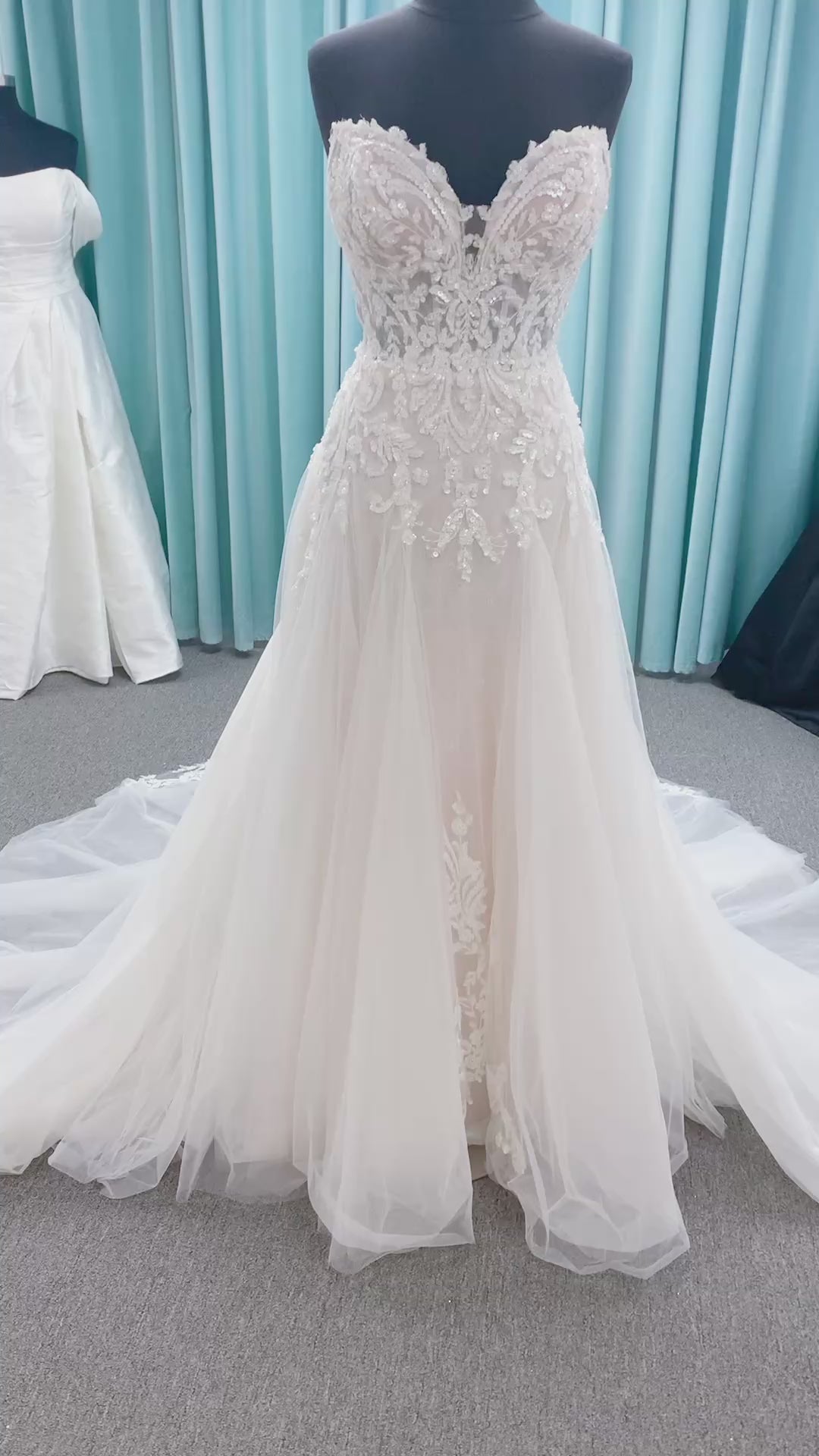 Morilee 2660 Regina A-line wedding dress with embroidered sweetheart neckline, matte sequins, drop waist, Chantilly lace tulle skirt, and lace-trimmed train.