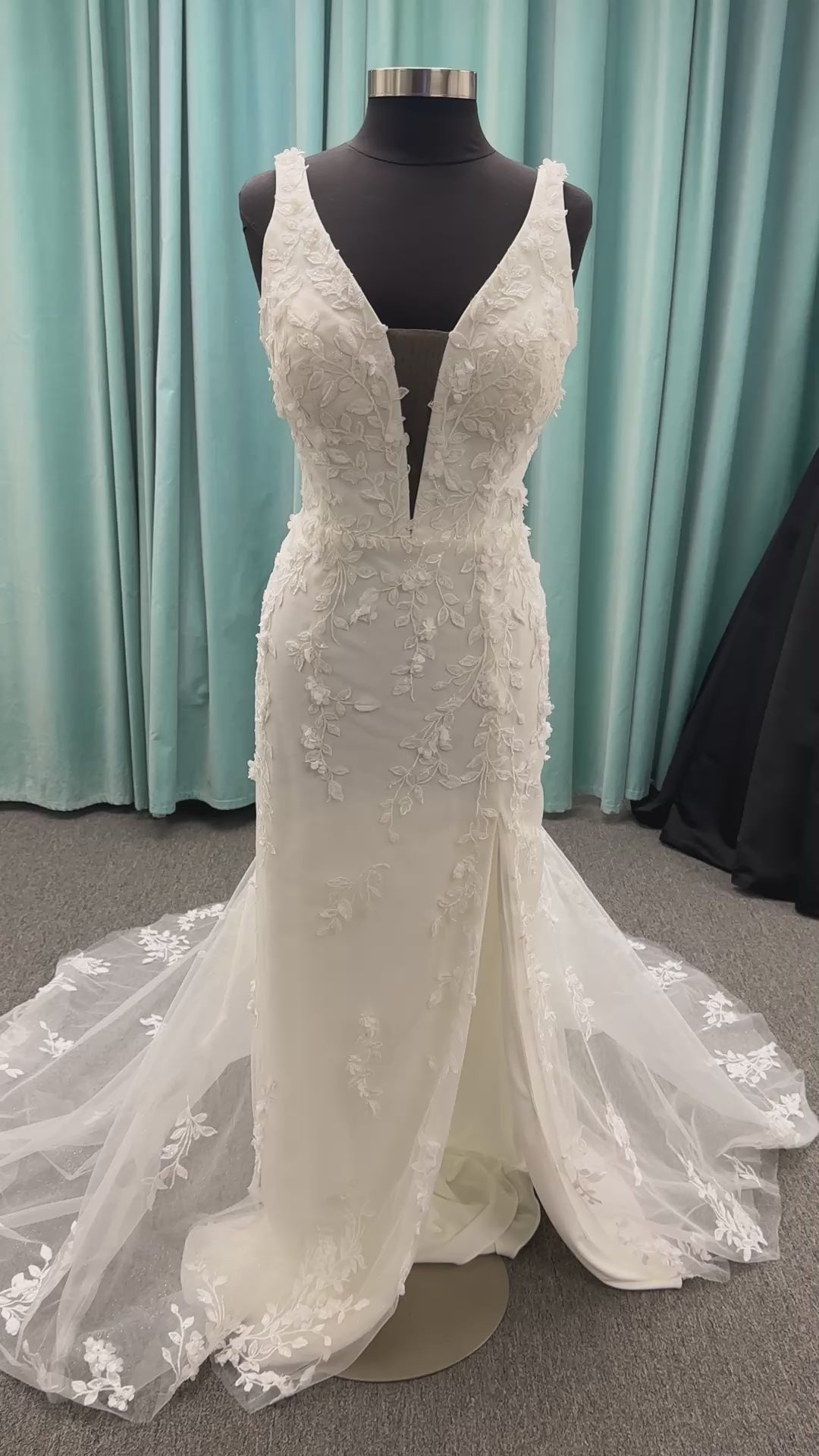 Stella York SY8157 glitter tulle fit-and-flare wedding dress with plunge neckline and floral lace appliqués
