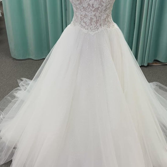 Paige ivory strapless sweetheart A-line wedding dress on mannequin with lace and tulle skirt.
