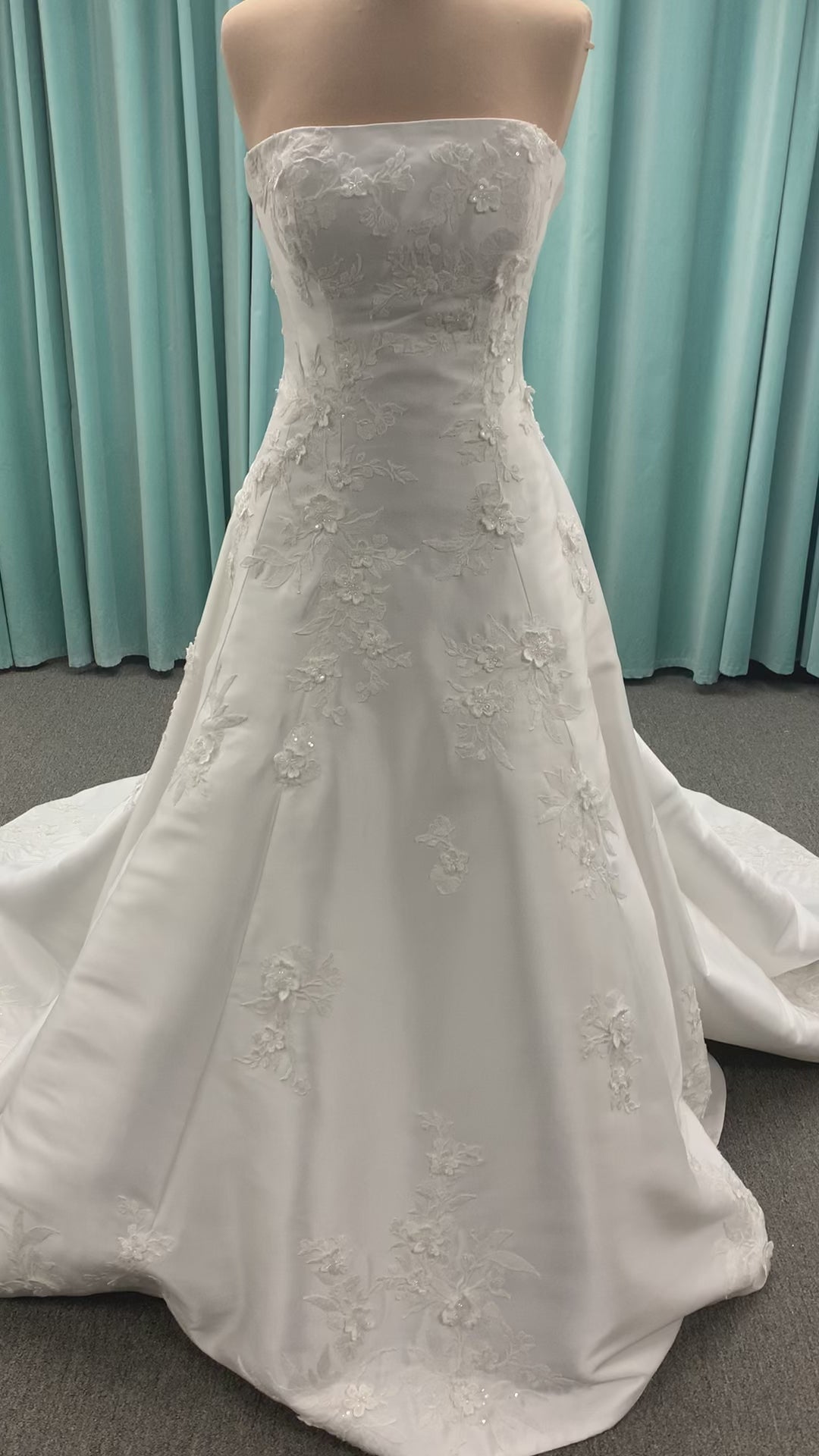 Strapless Mikado A-line wedding dress with straight neckline, lace detailing, and full skirt with hip volume by Essense of Australia Style D4479
