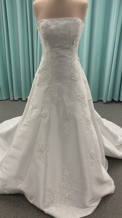 Strapless Mikado A-line wedding dress with straight neckline, lace detailing, and full skirt with hip volume by Essense of Australia Style D4479