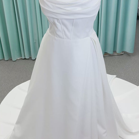 Morilee 15054 Pippa plus size A-line wedding dress in petal satin with cowl neck, corset bodice, pockets, front slit, and covered buttons to hem.
