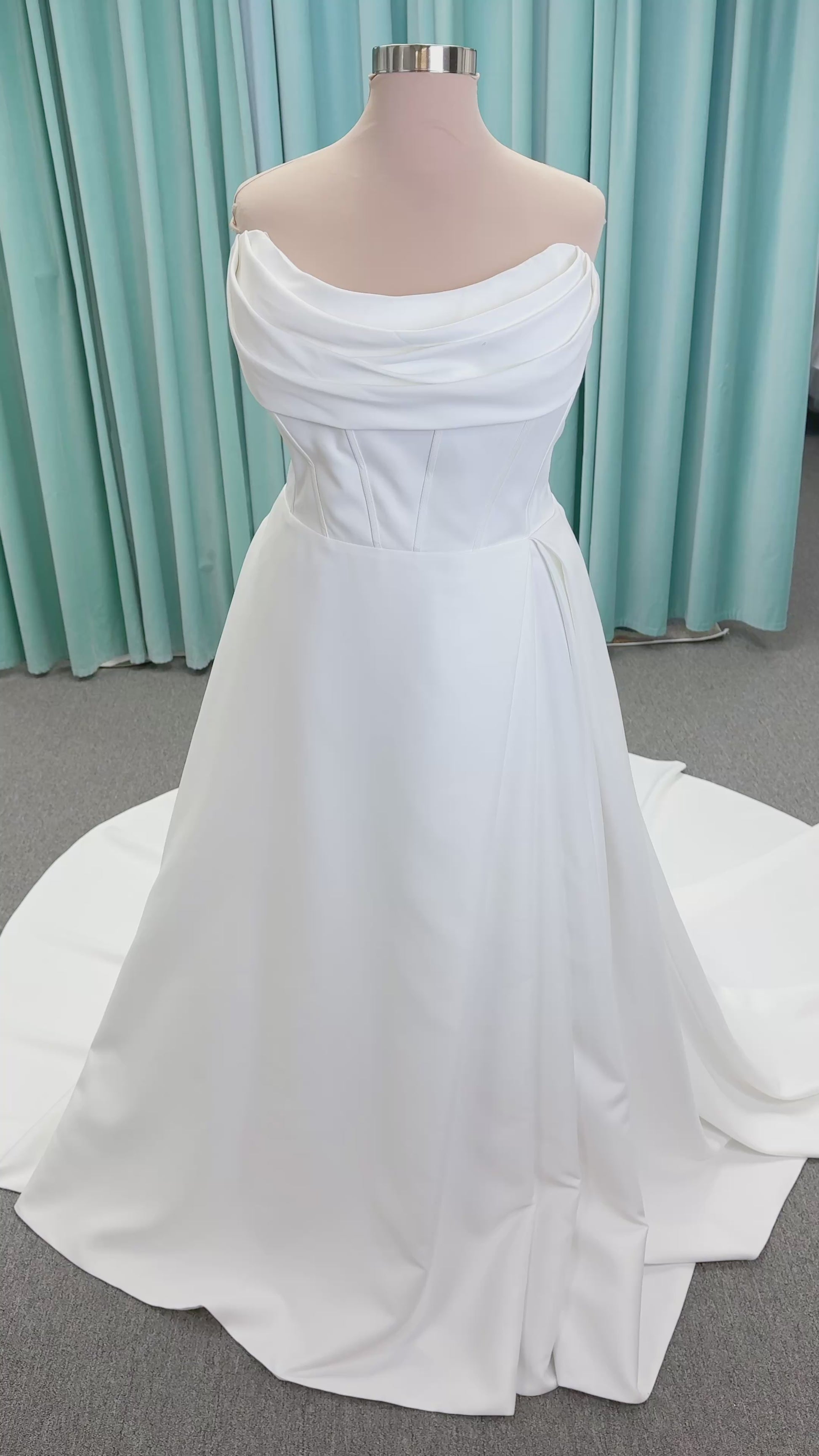 Morilee 15054 Pippa plus size A-line wedding dress in petal satin with cowl neck, corset bodice, pockets, front slit, and covered buttons to hem.