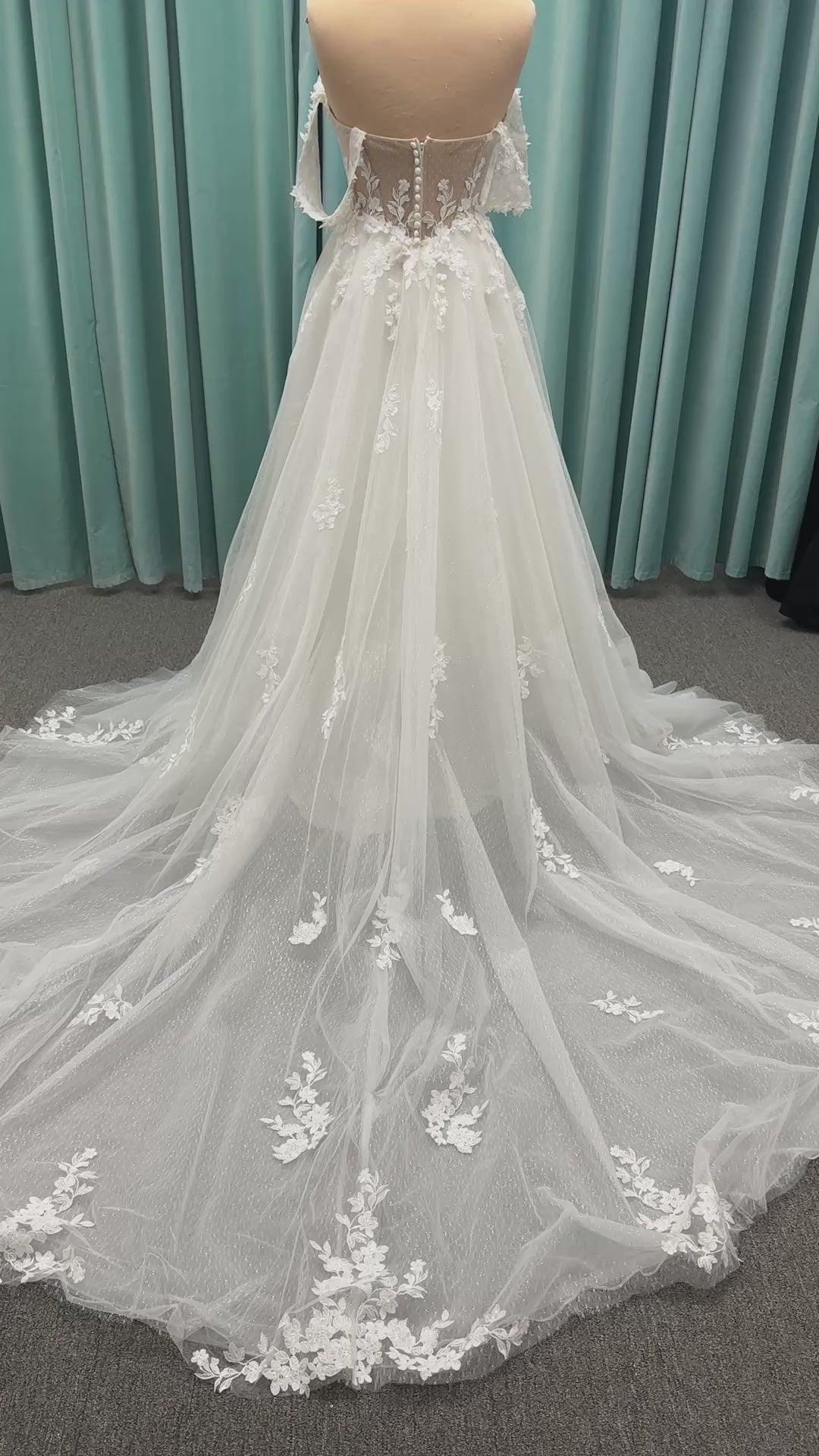 Off-the-shoulder lace A-line wedding dress with corset bodice, 3D floral appliqués, and glitter tulle skirt by Essense of Australia style D4360