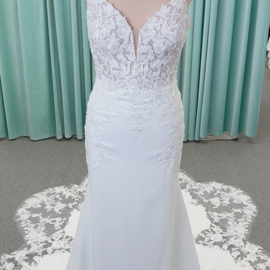 Morilee 2658 Raquel sheath wedding dress on mannequin with plunging neckline, frosted floral sparkle net bodice, crepe skirt, and keyhole back