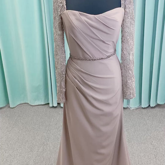 Morilee MLNY 73160 sheath mother of the bride dress on mannequin with modified sweetheart neckline, draped crepe bodice, sheer illusion long sleeves with lace applique, detachable beaded belt, and keyhole back