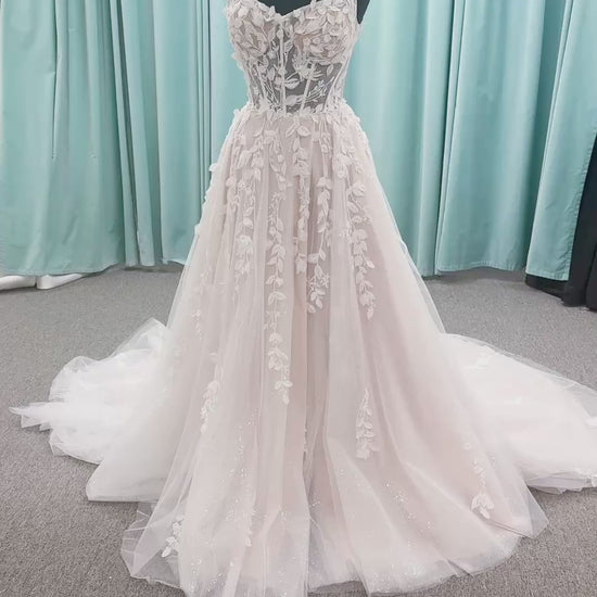 Amaryllis A-line Wedding Dress in Ivory/Cashmere, Size 12 — shimmering layered tulle, floral appliqués, soft romantic skirt