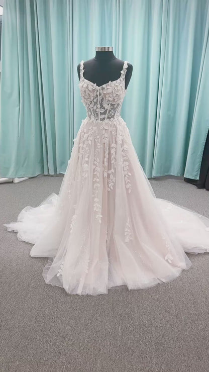 Amaryllis A-line Wedding Dress in Ivory/Cashmere, Size 12 — shimmering layered tulle, floral appliqués, soft romantic skirt