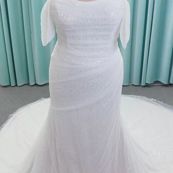 Morilee 3393 Lyrica fit and flare wedding dress in allover beaded net with draped tulle overlay, lace-up corset back, and detachable draped sleeves.