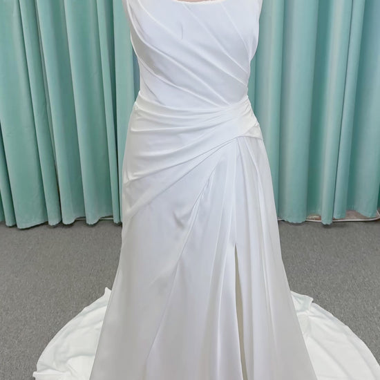 Morilee 2941 Zenobia fit and flare wedding dress on mannequin with strapless scoop neckline, asymmetric draped satin, and skirt slit