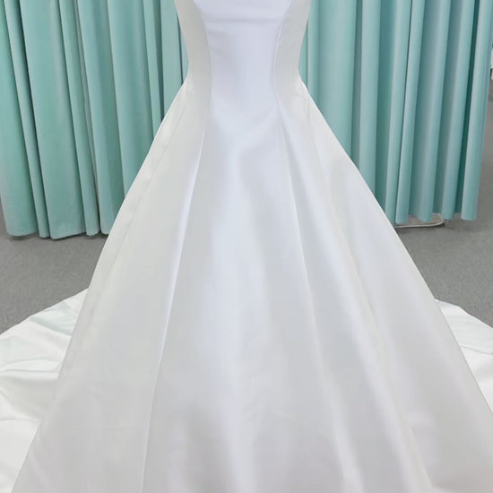Morilee 1050007 Sylvia modest A-line wedding dress on mannequin with high neckline, crystal and pearl beaded embroidery, and flowing chiffon skirt